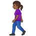 🚶🏾‍♀️ woman walking: medium-dark skin tone display on Samsung